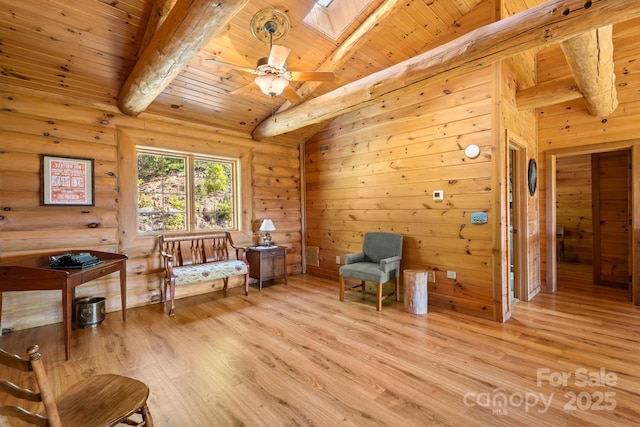 living area with a skylight, wooden ceiling, rustic walls, and light wood-type flooring