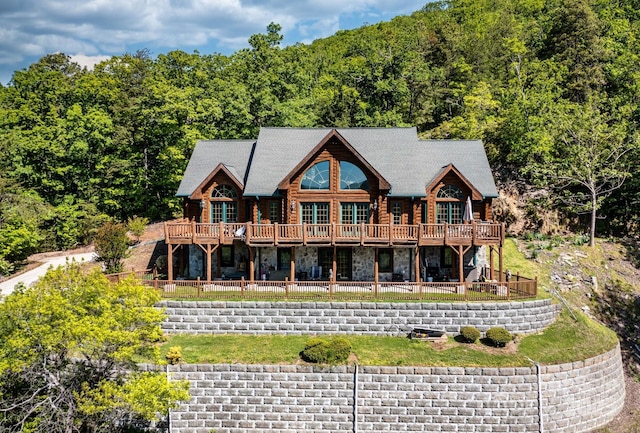 rear view of house featuring a deck