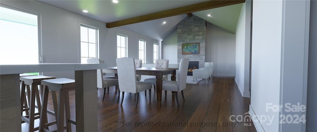 dining area with lofted ceiling with beams, dark hardwood / wood-style flooring, and a fireplace