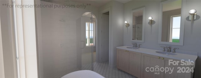 bathroom with dual vanity, tile floors, and a wealth of natural light