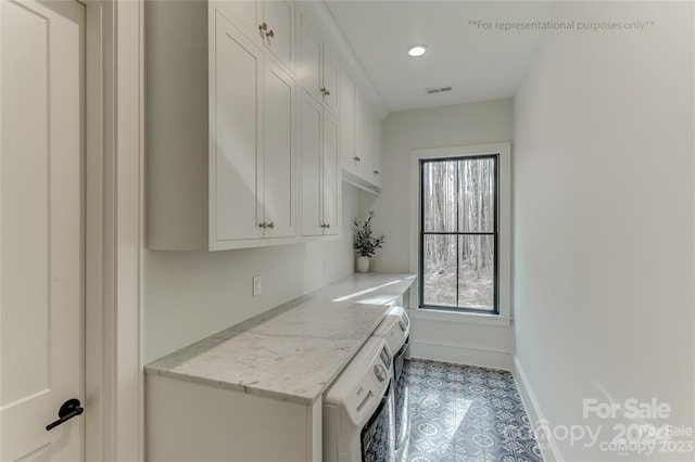 washroom with washer / clothes dryer and light tile flooring