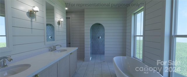 bathroom with wooden walls, double sink, large vanity, and a bath