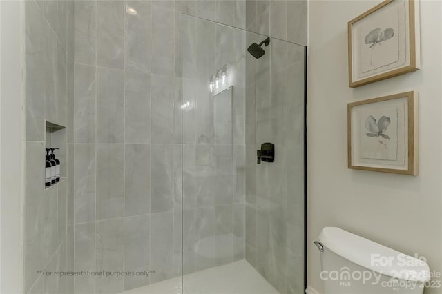 bathroom with walk in shower and toilet