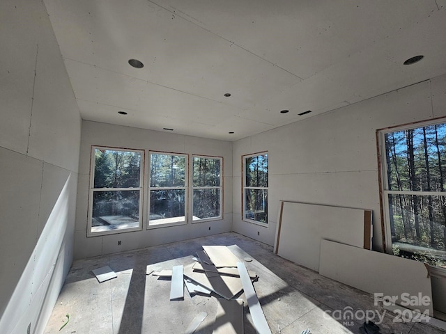 unfurnished living room featuring a healthy amount of sunlight