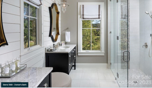 bathroom featuring toilet, tile floors, an enclosed shower, and oversized vanity