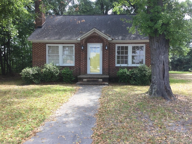 view of front of home with a front yard