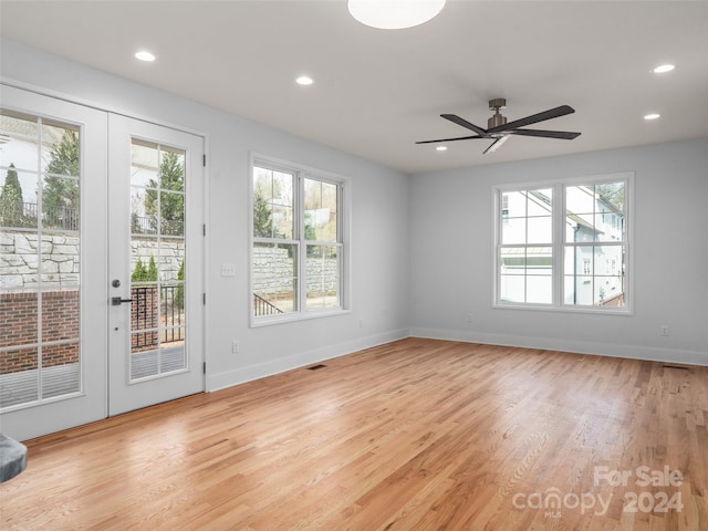 interior space with ceiling fan, light wood-type flooring, and french doors