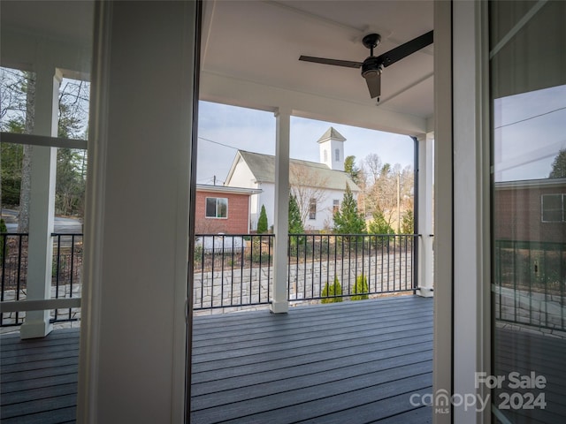 exterior space with ceiling fan