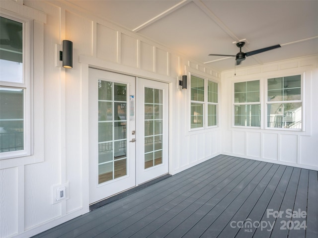 wooden deck featuring ceiling fan and french doors