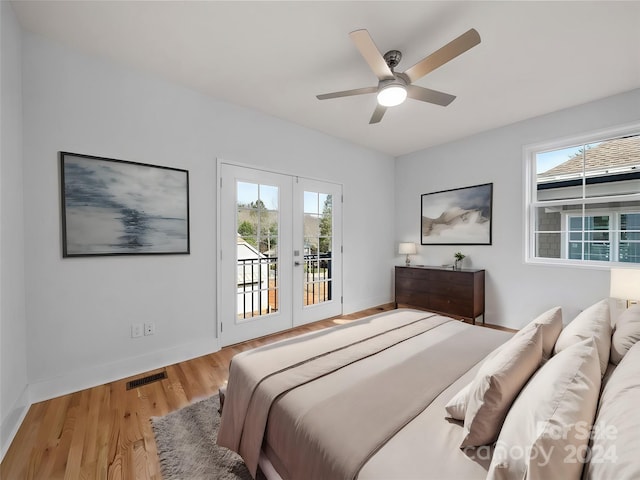 bedroom featuring ceiling fan, access to exterior, french doors, and wood-type flooring