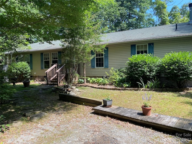 single story home with a wooden deck