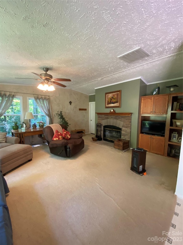 carpeted living room with ornamental molding, a textured ceiling, and ceiling fan