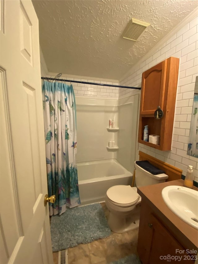 full bathroom with toilet, a textured ceiling, vanity, tile walls, and shower / tub combo with curtain