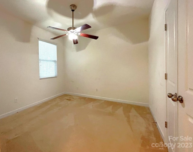 unfurnished room featuring light carpet and ceiling fan