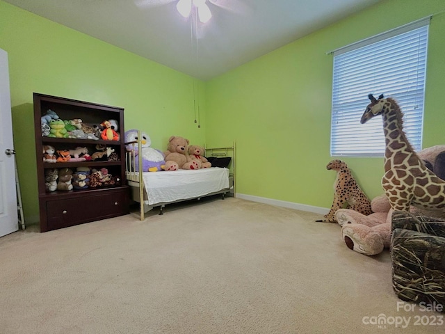 bedroom featuring ceiling fan and light colored carpet