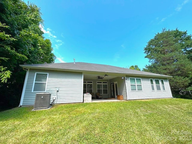 back of property featuring ceiling fan, central AC unit, a lawn, and a patio area