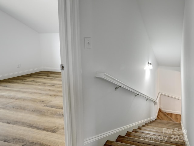 stairway with wood-type flooring