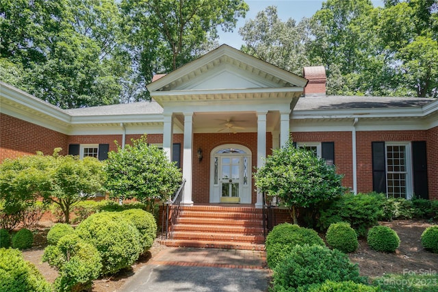 neoclassical home featuring a porch