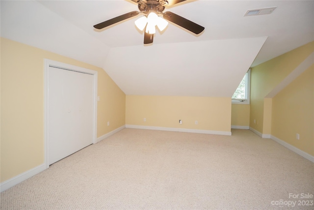 bonus room featuring ceiling fan, lofted ceiling, and light colored carpet