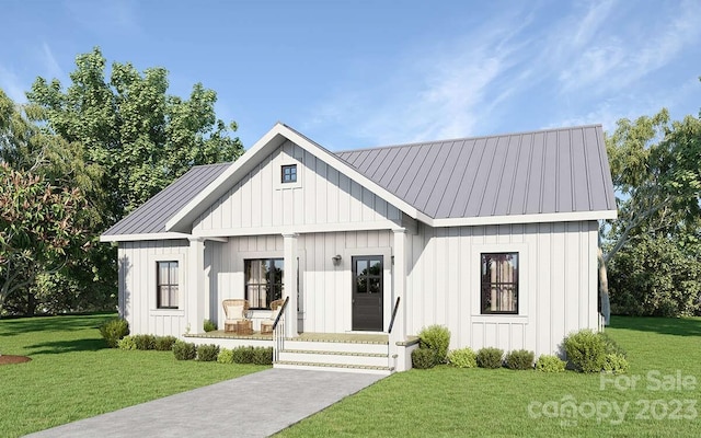 view of front facade with covered porch and a front yard