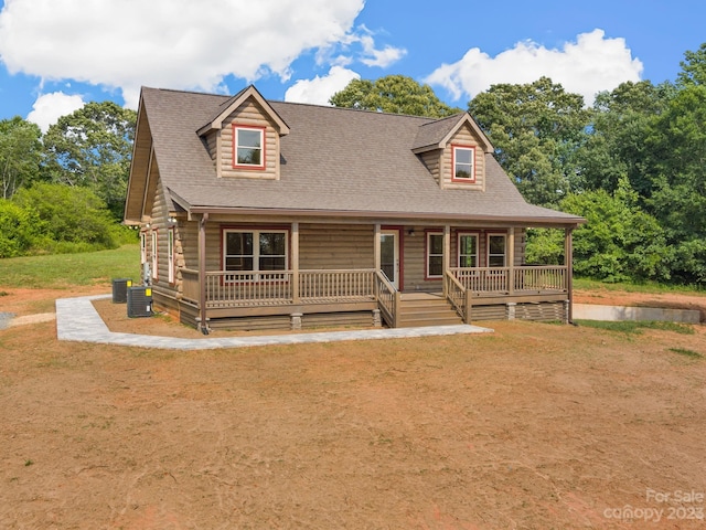 view of front of home featuring central air condition unit and covered porch