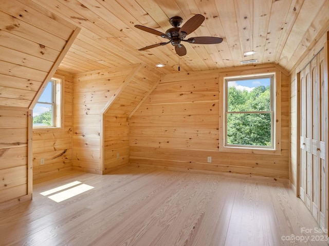 additional living space featuring wood ceiling, lofted ceiling, and light wood-type flooring