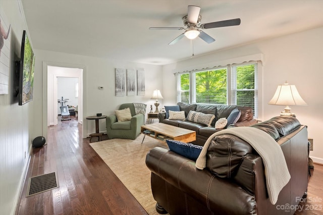 living room featuring ceiling fan and hardwood / wood-style floors