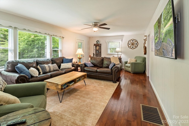 living room with hardwood / wood-style floors and ceiling fan