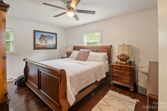 bedroom featuring dark hardwood / wood-style flooring and ceiling fan