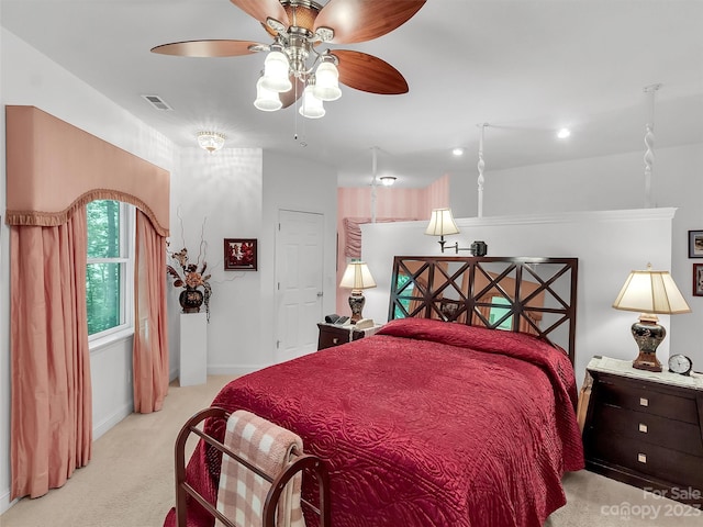 bedroom featuring light carpet and ceiling fan