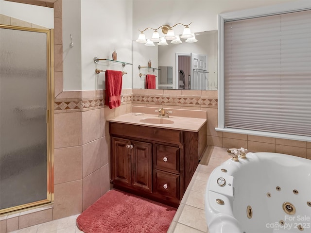 bathroom with a shower with shower door, oversized vanity, tile walls, and tile floors