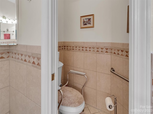 bathroom featuring tile walls and tile floors