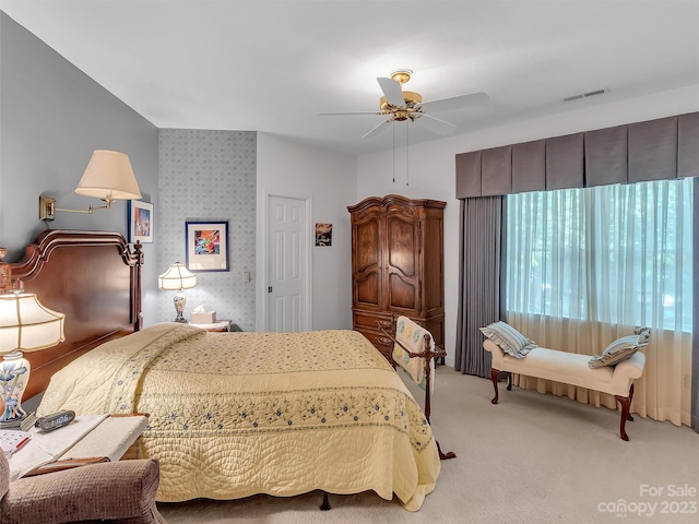 carpeted bedroom with ceiling fan