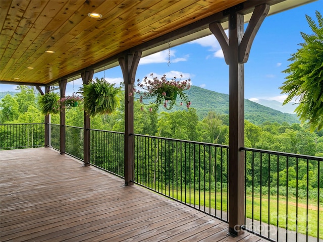 wooden deck featuring a mountain view