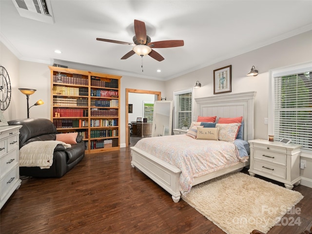 bedroom with ceiling fan, dark hardwood / wood-style flooring, and ornamental molding