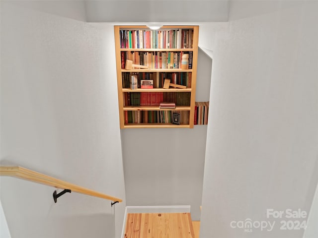 staircase featuring hardwood / wood-style flooring