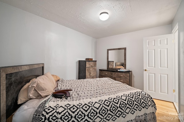 bedroom with light hardwood / wood-style flooring