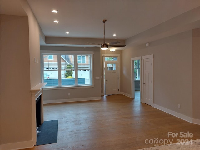 foyer with wood-type flooring and ceiling fan