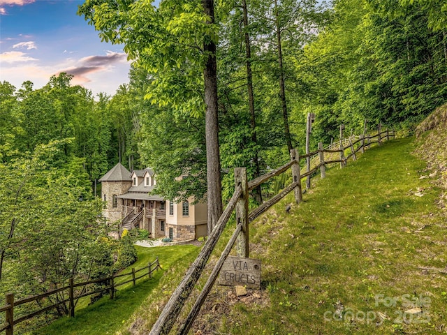 202 Emerald Ln, Maggie Valley, NC 28751 - view of yard with stairs, a wooden deck, and a view of trees