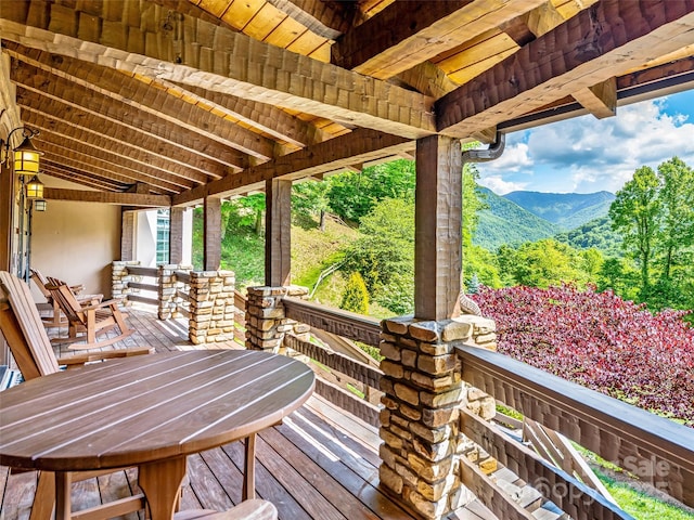 202 Emerald Ln, Maggie Valley, NC 28751 - deck with outdoor dining area, a mountain view, and a porch