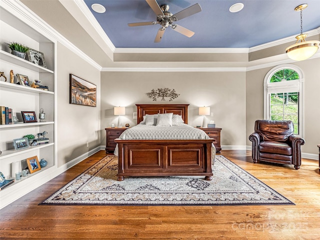 202 Emerald Ln, Maggie Valley, NC 28751 - bedroom with wood finished floors, ornamental molding, a raised ceiling, baseboards, and ceiling fan