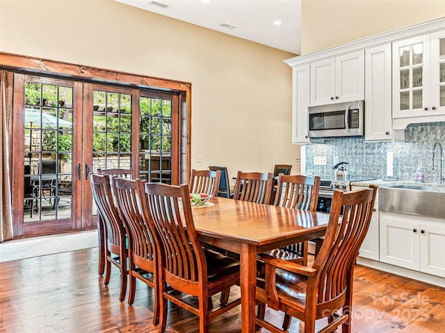 202 Emerald Ln, Maggie Valley, NC 28751 - dining area featuring recessed lighting, light wood-type flooring, and french doors