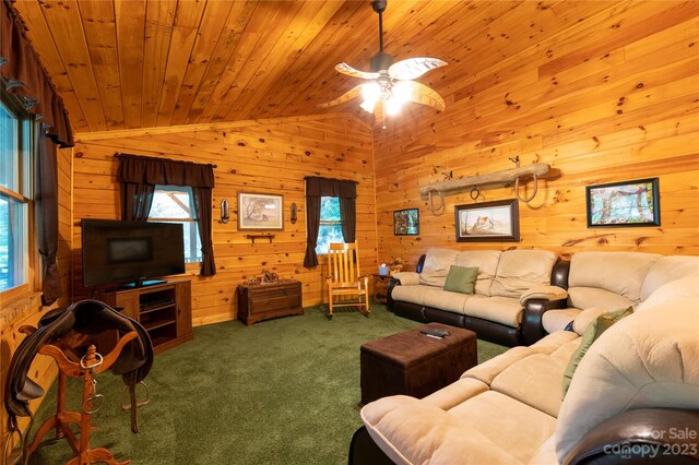 carpeted living room featuring ceiling fan, wood walls, and wood ceiling