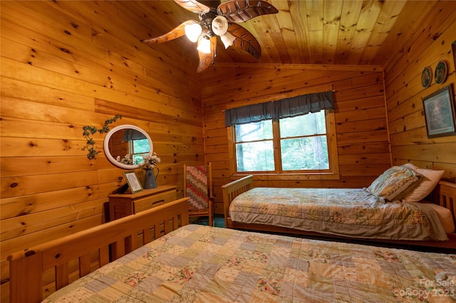 bedroom with ceiling fan, wood ceiling, wooden walls, and vaulted ceiling