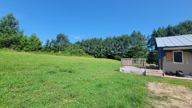 view of yard with a wooden deck