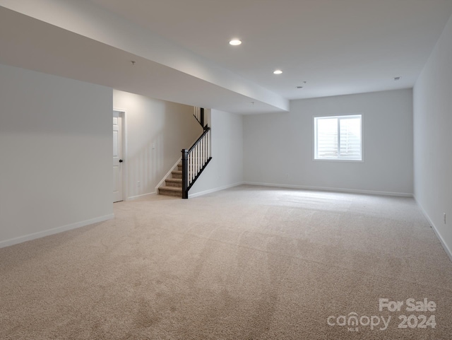 basement with light colored carpet