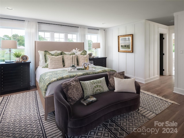 bedroom with dark wood-type flooring