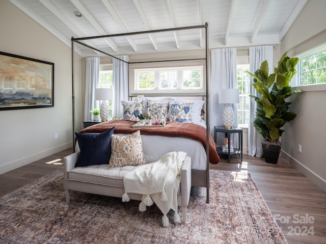 bedroom featuring wooden ceiling, lofted ceiling with beams, and wood-type flooring