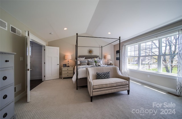 carpeted bedroom with vaulted ceiling