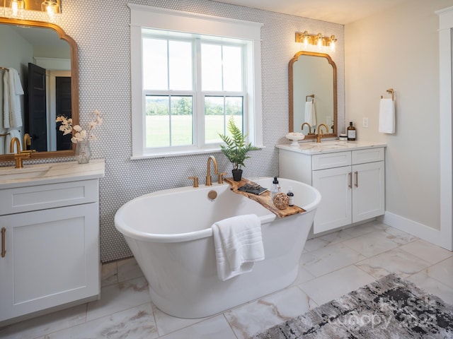 bathroom with vanity and a bathing tub